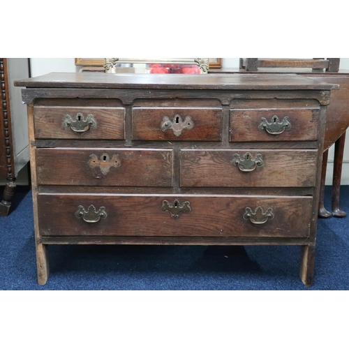 53 - A Georgian ash chest of drawers with three short over two over one long drawers on bracket supports ... 