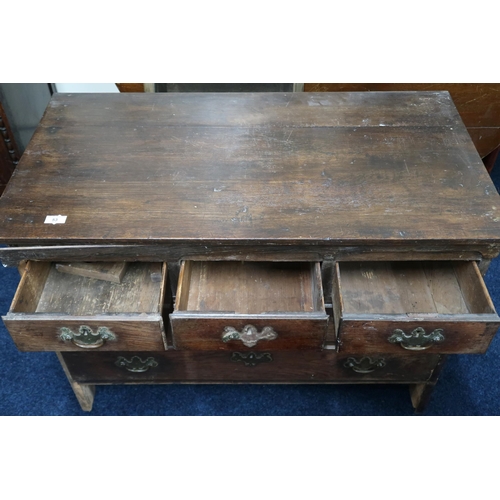 53 - A Georgian ash chest of drawers with three short over two over one long drawers on bracket supports ... 