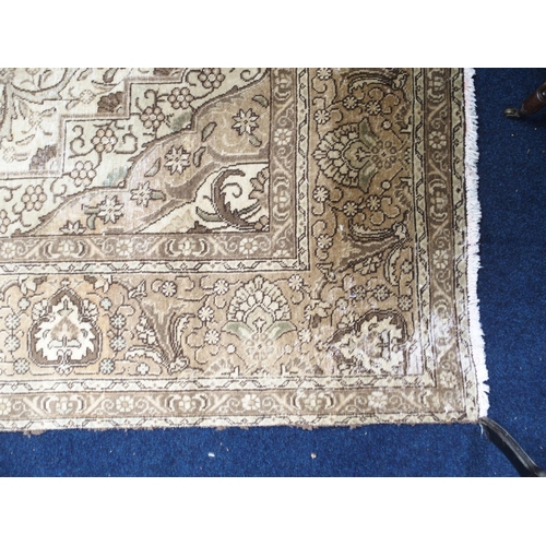 6 - A large beige ground Tabriz carpet with darker central medallion and spandrels on floral/foliate pat... 