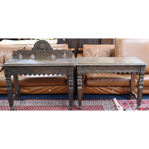 68 - A pair of 19th century carved oak hall tables, the larger with carved foliate back splash over gadro... 