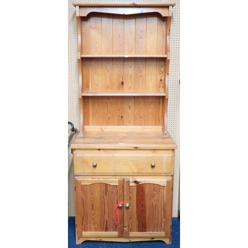 71 - A 20th century pine kitchen dresser with two tier plate rack on base with one long drawer over pair ... 