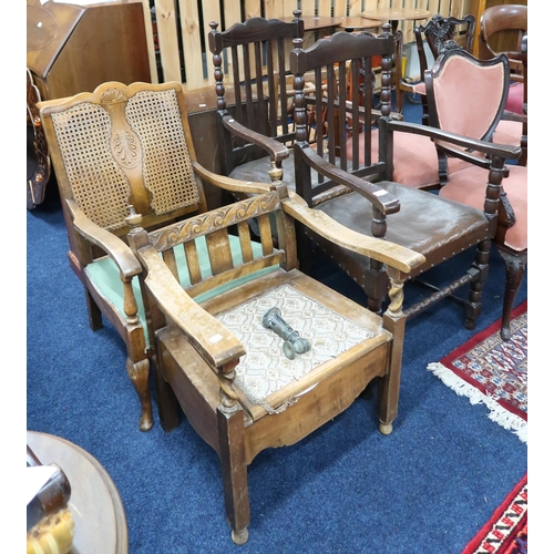 84 - A lot comprising a pair of oak armchairs, bergere armchair and an oak armchair with hinged seat (4)