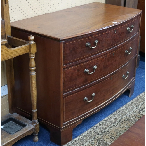 9 - A George III mahogany inlaid bow front three drawer chest with original brass drawer pulls on bracke... 