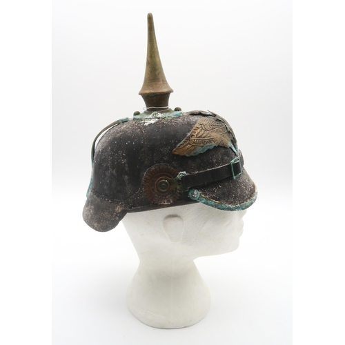 412 - A Prussian Garde du Corps other ranks pickelhaube, in relic condition; together with a partial repro... 