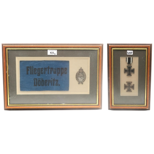 422 - A WW1 Imperial German Prussian pilot's badge, mounted in a glazed frame alongside an armband printed... 