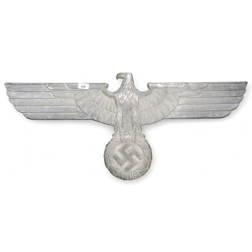 428 - A German Third Reich aluminium alloy wall Reichsadler (eagle), stamped verso 