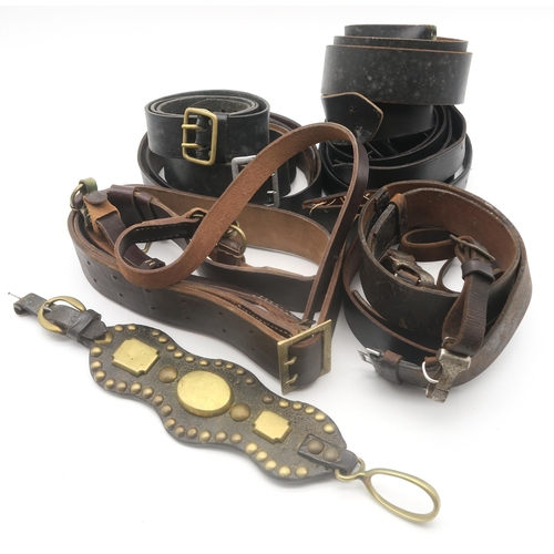 434 - A collection of military leather belts, some being in the Sam Browne style, to include German exampl... 