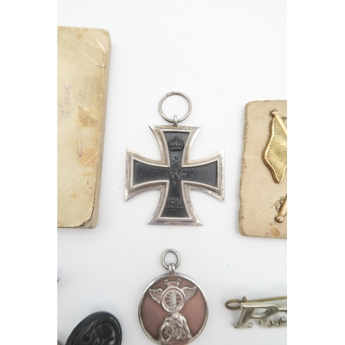 435 - A WW1 Imperial German Iron Cross, with stamped suspension ring; a motorcycling fob medal engraved ve... 