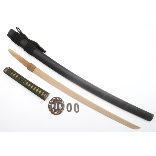 436 - A Japanese Wakizashi, with wooden blade measuring approx. 54cm in length, the grip of white shagreen... 