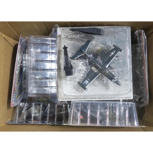 480 - A large quantity of packaged diecast model military aircraft, to include examples issued as part of ... 