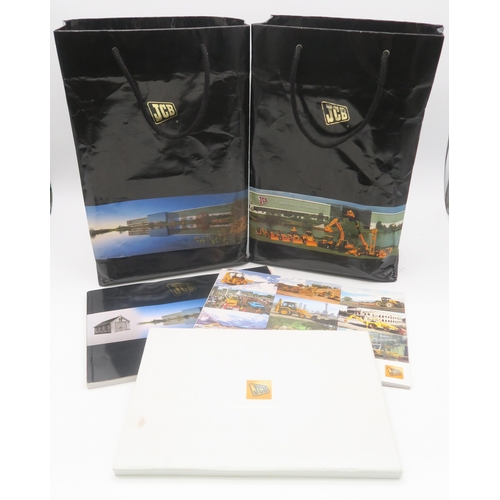 487 - Two JCB Millennium commemorative model packs, together with three various JCB commemorative publicat... 