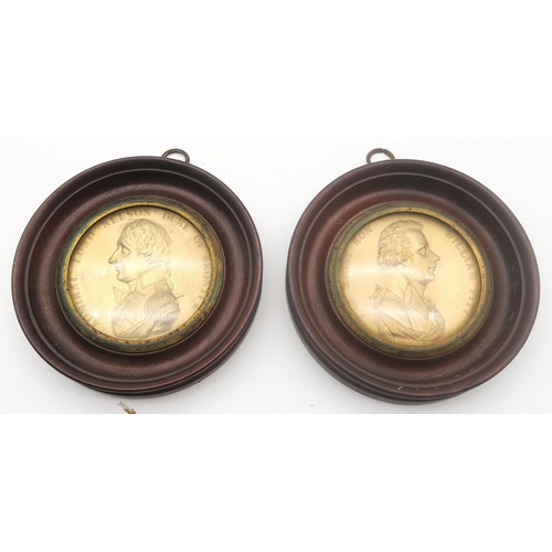 489 - A pair of gilt medallions depicting Admiral Lord Nelson, Duke of Bronti and the Right Hon. William P... 