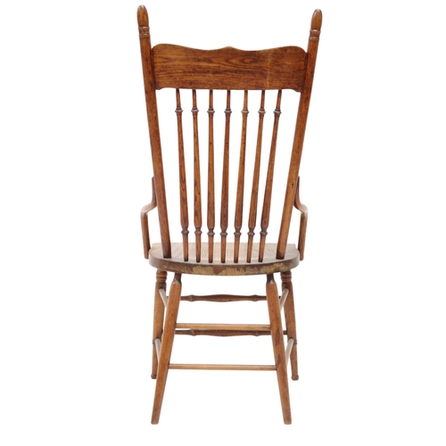 2019A - A LATE 19TH CENTURY AMERICAN OAK RAIL BACK ARMCHAIRWith turned rail back over shaped seat flanked by... 