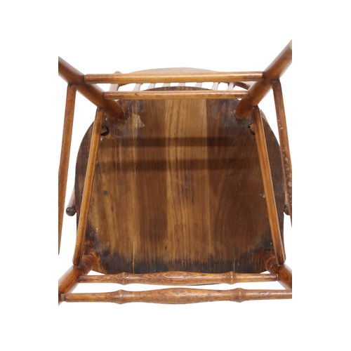 2019A - A LATE 19TH CENTURY AMERICAN OAK RAIL BACK ARMCHAIRWith turned rail back over shaped seat flanked by... 