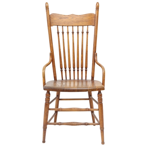 2019A - A LATE 19TH CENTURY AMERICAN OAK RAIL BACK ARMCHAIRWith turned rail back over shaped seat flanked by... 