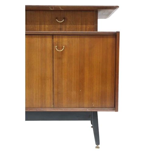 2108A - A MID 20TH CENTURY G PLAN E-GOMME LIBRENZA DINING SUITEComprising Tola sideboard with three short dr... 