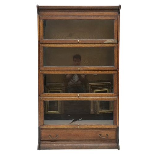 2034A - A LATE 19TH CENTURY OAK FRANCIS SMITH, GLASGOW FOUR TIER SECTIONAL BOOKCASEWith four glazed sliding ... 