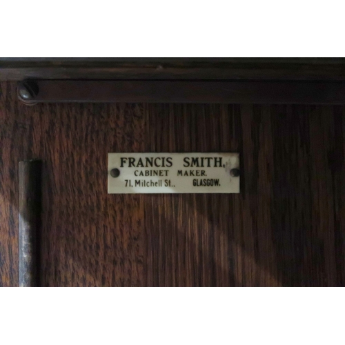 2034A - A LATE 19TH CENTURY OAK FRANCIS SMITH, GLASGOW FOUR TIER SECTIONAL BOOKCASEWith four glazed sliding ... 