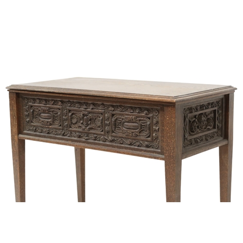 2007A - A 19TH CENTURY OAK SIDE TABLEWith rectangular hinged top over carved friezes on square tapering supp... 