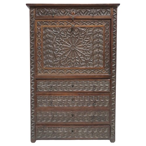 2011A - A 19TH CENTURY CONTINENTAL STYLE WALNUT SECRETAIRE ABATTANTWith extensively carved front with single... 