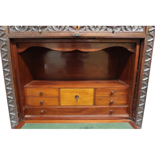 2011A - A 19TH CENTURY CONTINENTAL STYLE WALNUT SECRETAIRE ABATTANTWith extensively carved front with single... 