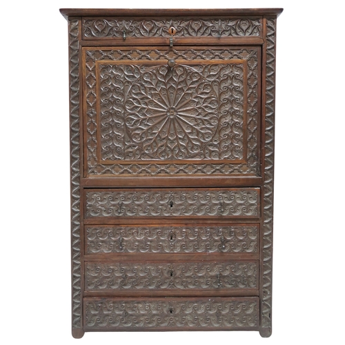 2011A - A 19TH CENTURY CONTINENTAL STYLE WALNUT SECRETAIRE ABATTANTWith extensively carved front with single... 