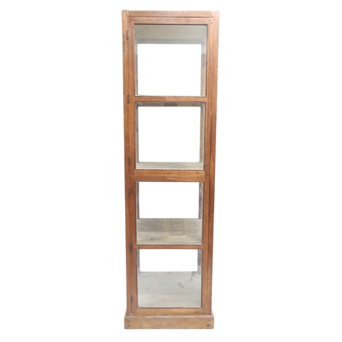 2013B - A 20th CENTURY TEAK FRAMED HABERDASHERY STYLE SHOPS DISPLAY CABINETWith two glazed doors enclosing f... 