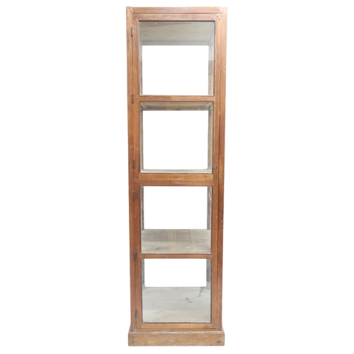 2013B - A 20th CENTURY TEAK FRAMED HABERDASHERY STYLE SHOPS DISPLAY CABINETWith two glazed doors enclosing f... 