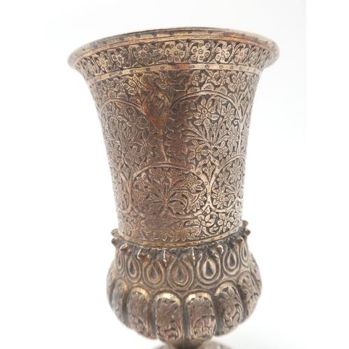 2505 - A PERSIAN WHITE METAL CHALICE AND STANDof slightly flaring form, the body partly fluted, engraved wi... 