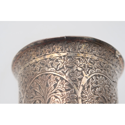 2505 - A PERSIAN WHITE METAL CHALICE AND STANDof slightly flaring form, the body partly fluted, engraved wi... 