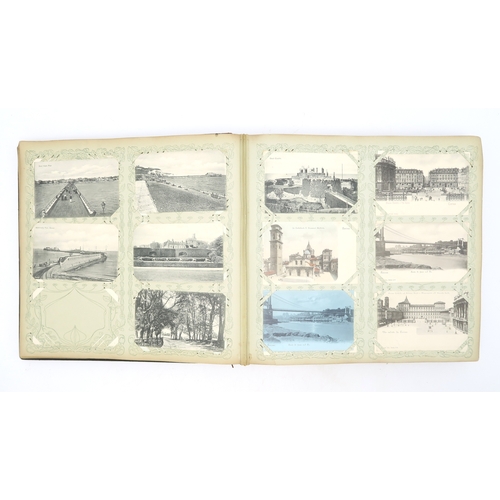 2633 - A SUBSTANTIAL LEATHER-BOUND POSTCARD ALBUMEarly-20th century, containing approximately 750 postcards... 