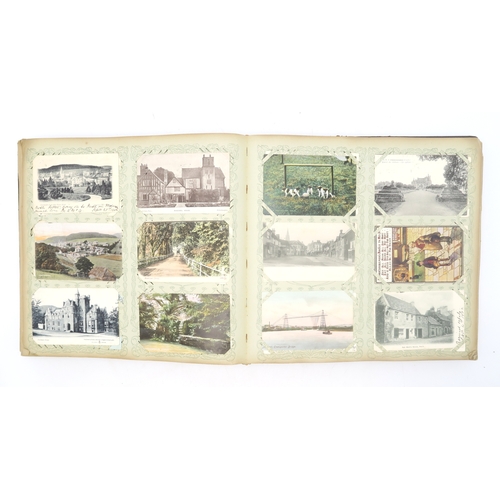 2633 - A SUBSTANTIAL LEATHER-BOUND POSTCARD ALBUMEarly-20th century, containing approximately 750 postcards... 