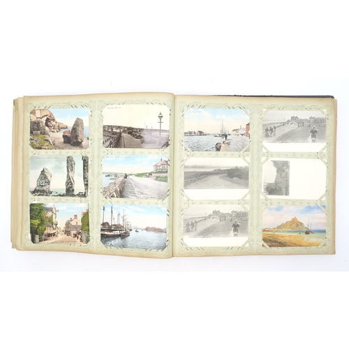 2633 - A SUBSTANTIAL LEATHER-BOUND POSTCARD ALBUMEarly-20th century, containing approximately 750 postcards... 