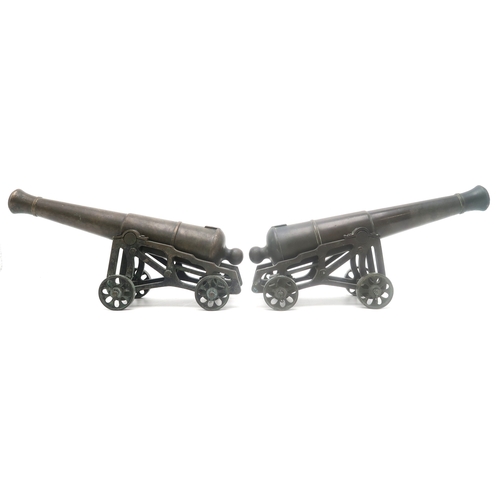 2635 - A PAIR OF MINIATURE BRONZE CANNONSEach with barrel measuring approx. 35cm in length, inclusive of kn... 