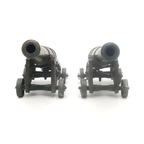 2635 - A PAIR OF MINIATURE BRONZE CANNONSEach with barrel measuring approx. 35cm in length, inclusive of kn... 