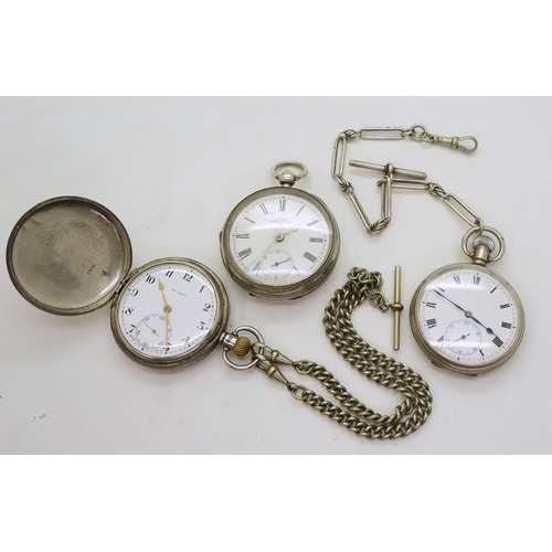 9007 - Three silver pocket watches. A Waltham open face pocket watch, movement 10666066, case with UK hallm... 