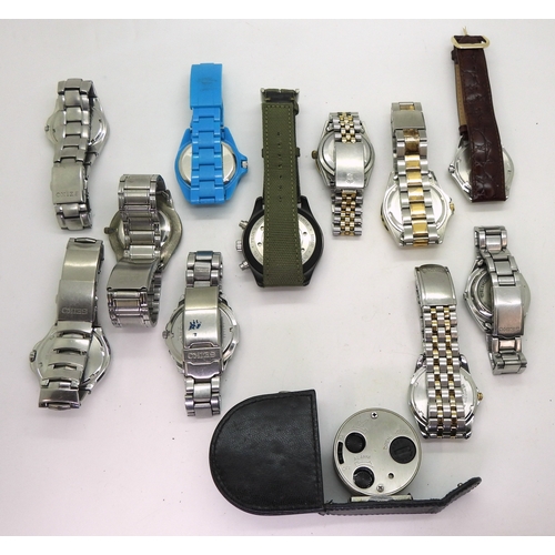 9026 - A collection of fashion watches (11) and a traveling alarm clock. Please note, this lot is sold as s... 