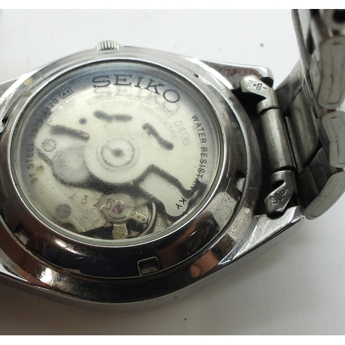 9026 - A collection of fashion watches (11) and a traveling alarm clock. Please note, this lot is sold as s... 