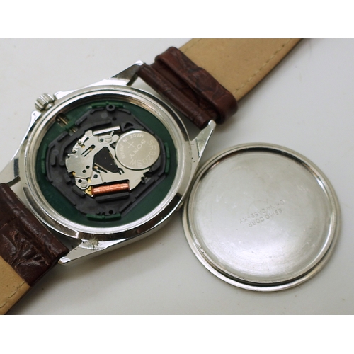 9026 - A collection of fashion watches (11) and a traveling alarm clock. Please note, this lot is sold as s... 