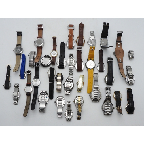 9028 - A large collection of fashion watches Please note, this lot is sold as seen, it contains replicas.