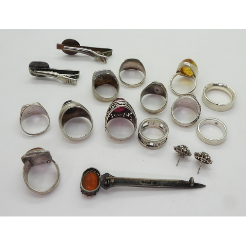 9031 - A Robert Allison brooch, set with a glass gem, two silver and white metal charm bracelets to include... 