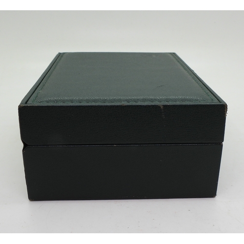 9041 - Two boxes marked Rolex. A green leatherette box with wood clad interior, signed in green Rolex, with... 