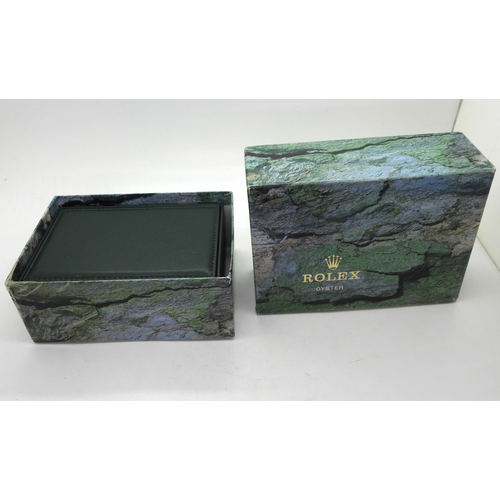 9041 - Two boxes marked Rolex. A green leatherette box with wood clad interior, signed in green Rolex, with... 