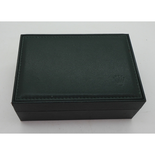 9041 - Two boxes marked Rolex. A green leatherette box with wood clad interior, signed in green Rolex, with... 