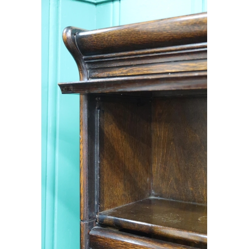 1 - An early 20th century after Globe Wernicke oak three tier sectional bookcase with glazed doors on sh... 