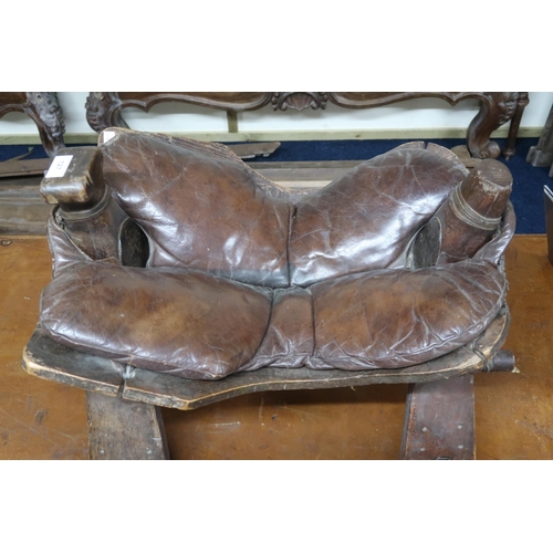 127 - A 20th century leather seated camel saddle