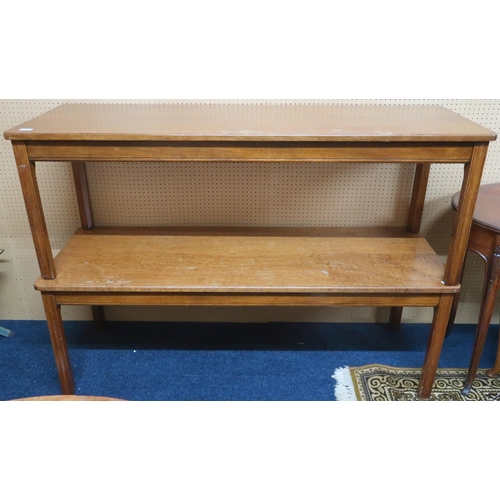 133 - A pair of mid 20th century stained teak long coffee tables with rectangular tops on shaped chamfered... 