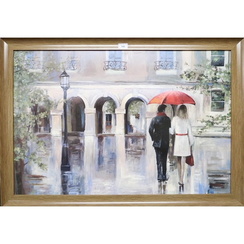 145 - A frame print depicting a continental city scene in the rain