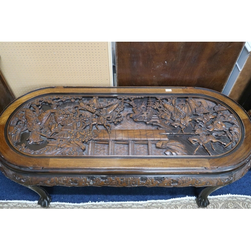 25 - A 20th century Chinese hardwood coffee table top carved with Chinese warriors on horseback on lions ... 