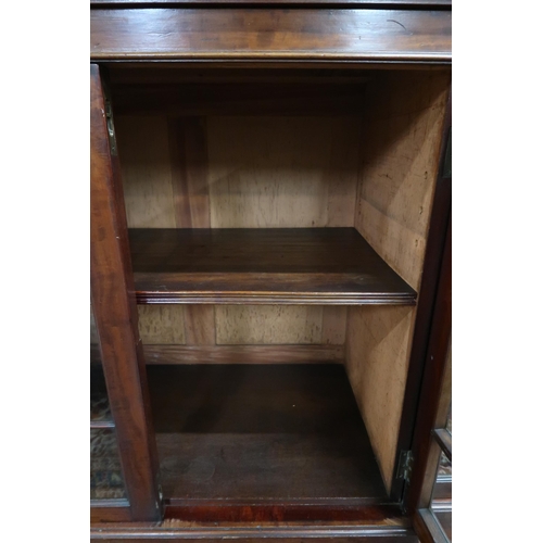 31 - A 20th century mahogany astragal glazed breakfront cabinet with pair of central glazed doors flanked... 